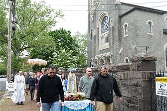 Parishioners pray for peace and life during Marian Eucharistic procession