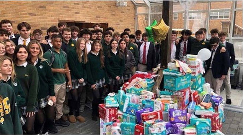 Diocesan Catholic Athletes for Christ collect thousands of diapers for local aid agencies