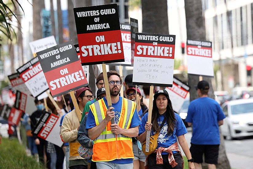 Will AI serve or replace Hollywood's human writers on strike for better wages?