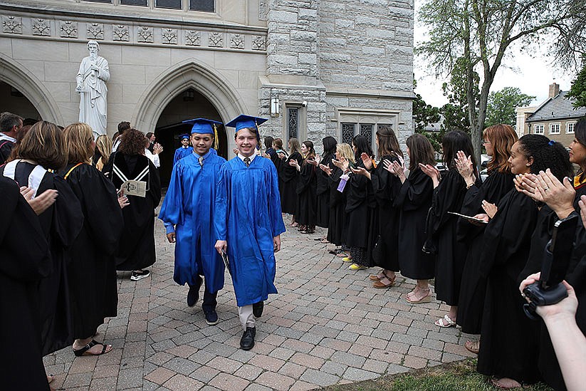 Moving forward in faith: Eighth-grade graduates ready for high school